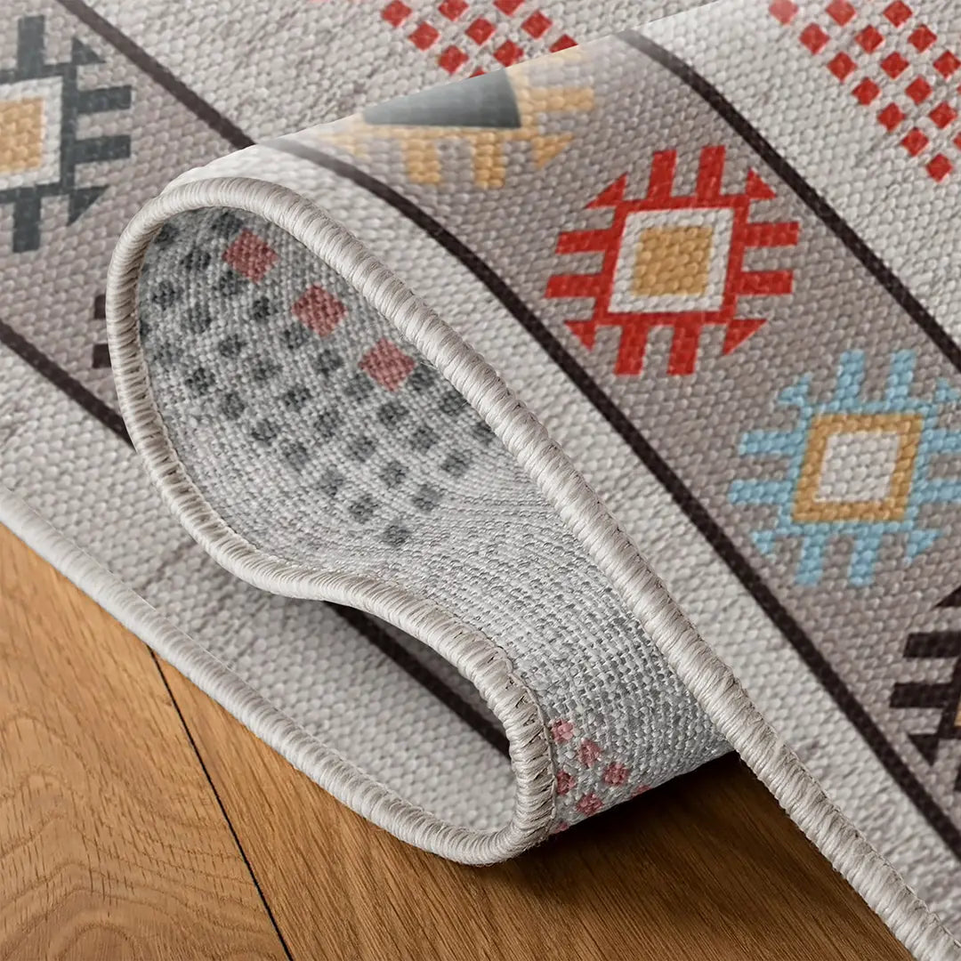 Earth-Tone Rug with Symmetrical Geometric and Stylized Floral Patterns